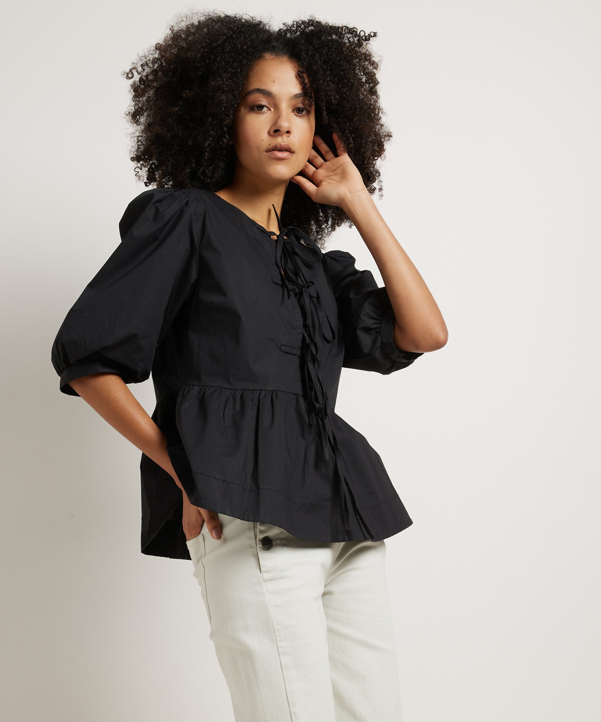 peplum top met strikjes